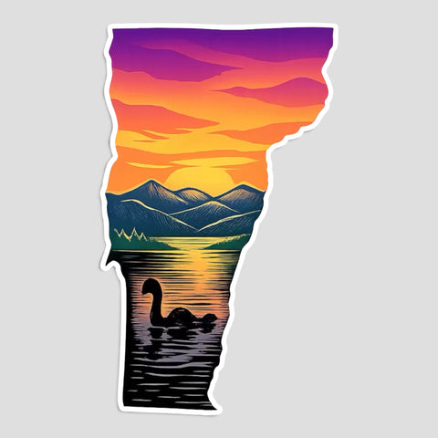 Die-cut sticker shaped like Vermont showing a sunset over Lake Champlain with the Green Mountains and Champ the lake monster